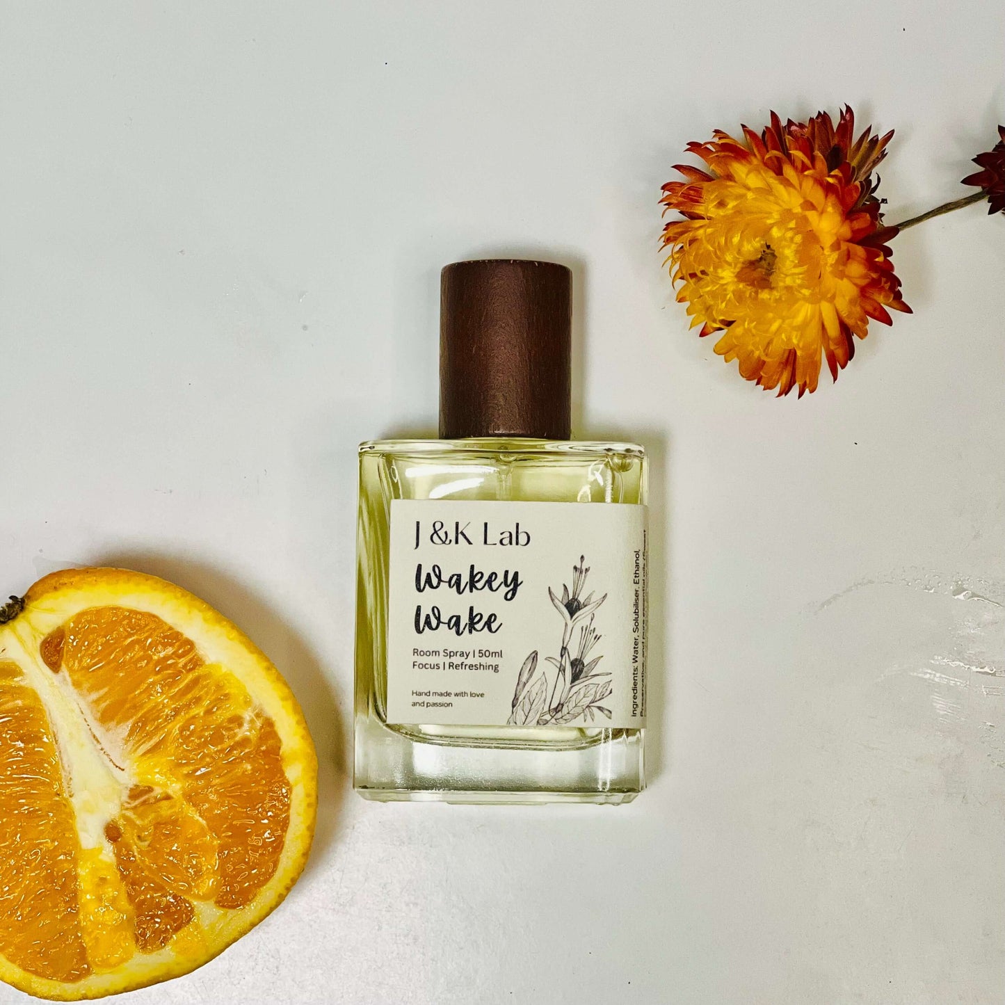 Wakey Wake Room Spray bottle with sweet orange and flowers, a refreshing essential oil room spray for energizing aromatherapy.