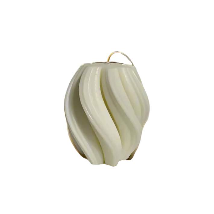 A white candle with a twisted geometric design